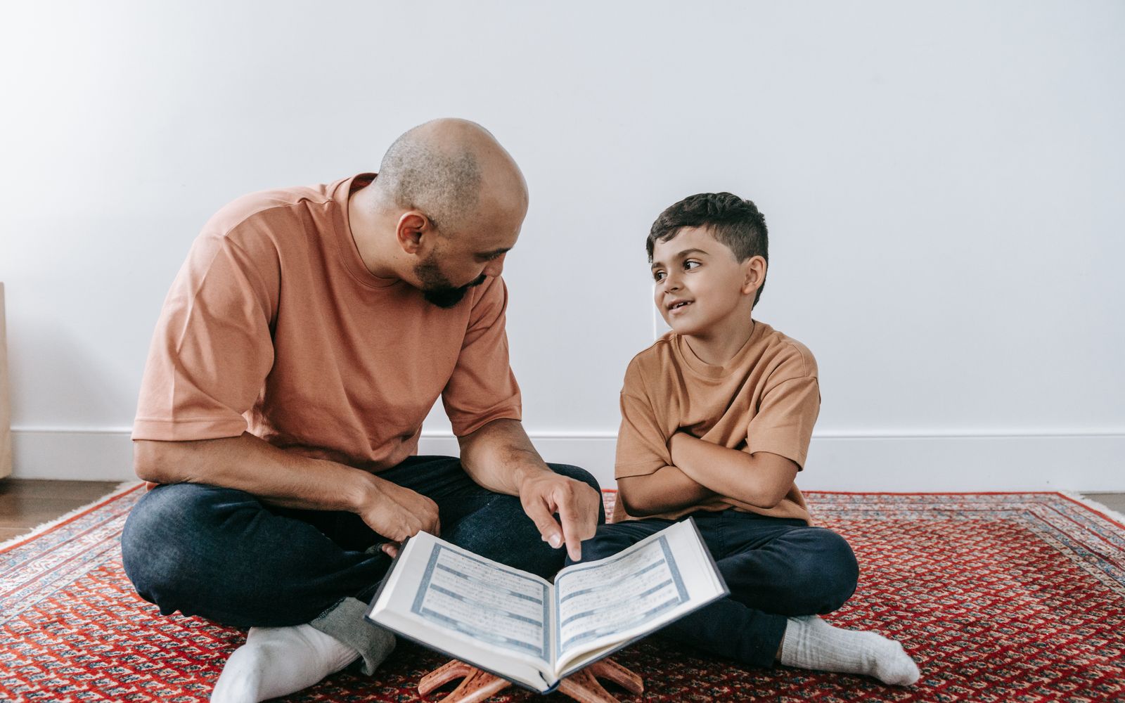 A tutor and student working together at a study table